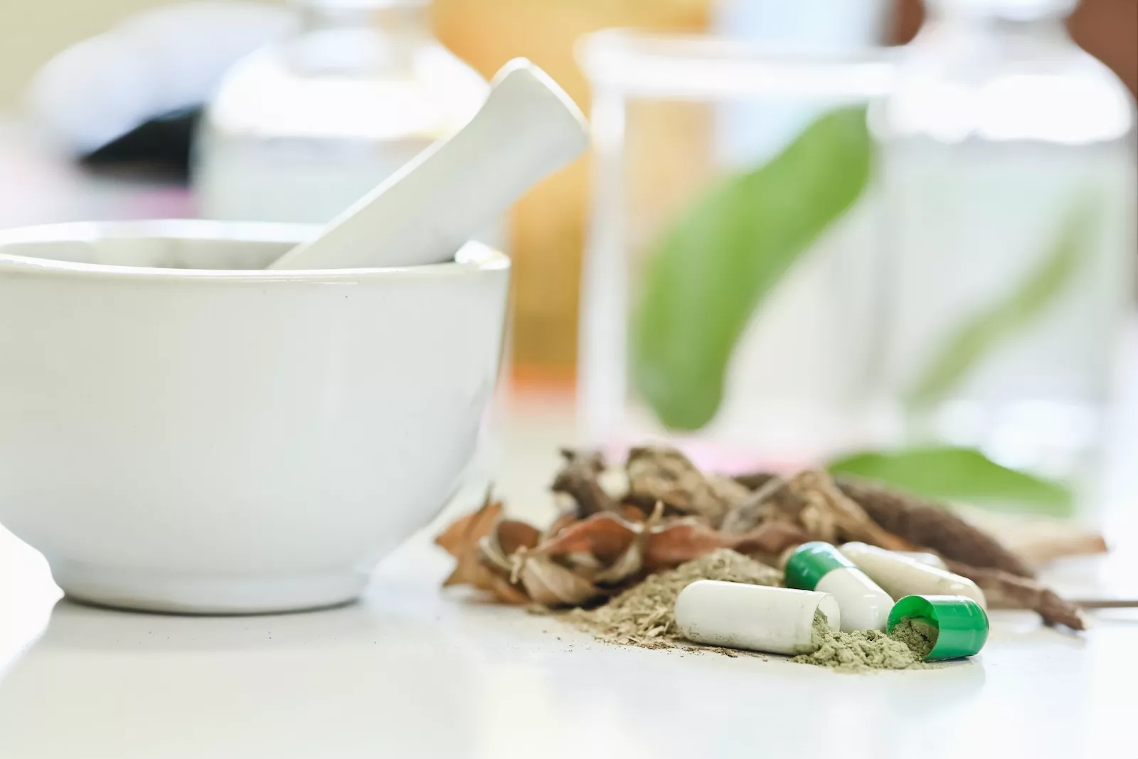 Assorted herbal medicine bottles and natural supplements